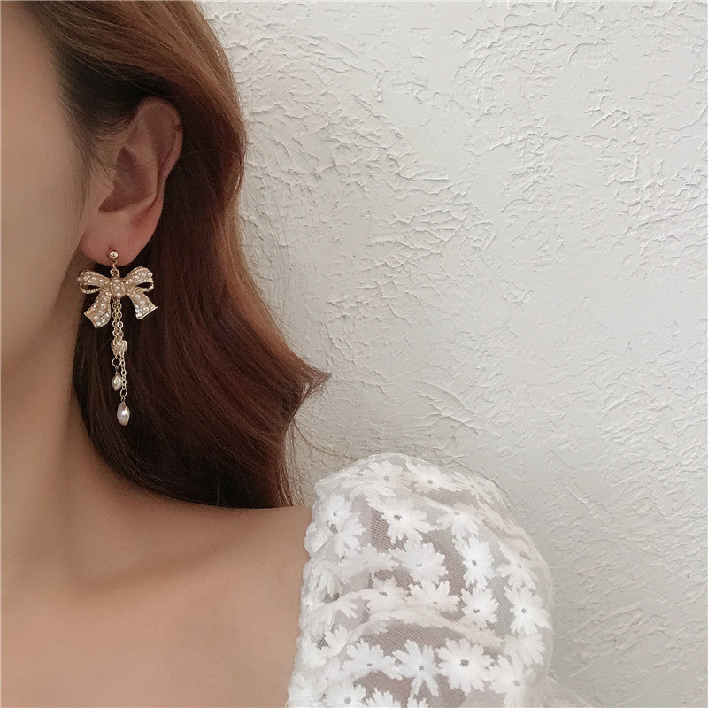 White Pearl Bow Shape Clip on Earrings